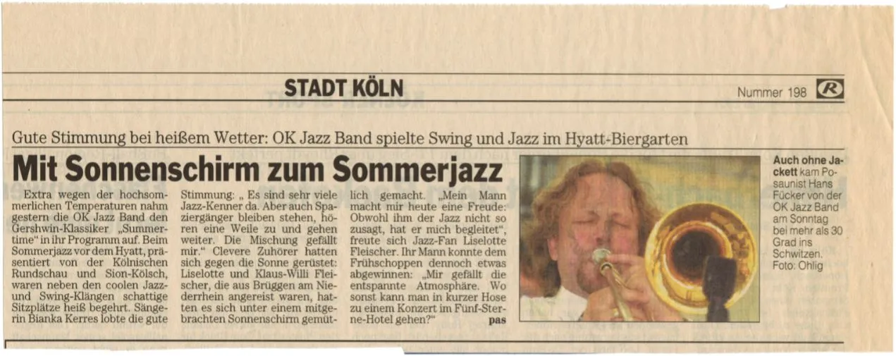 Pressestimme - Mit Sonnenschirm